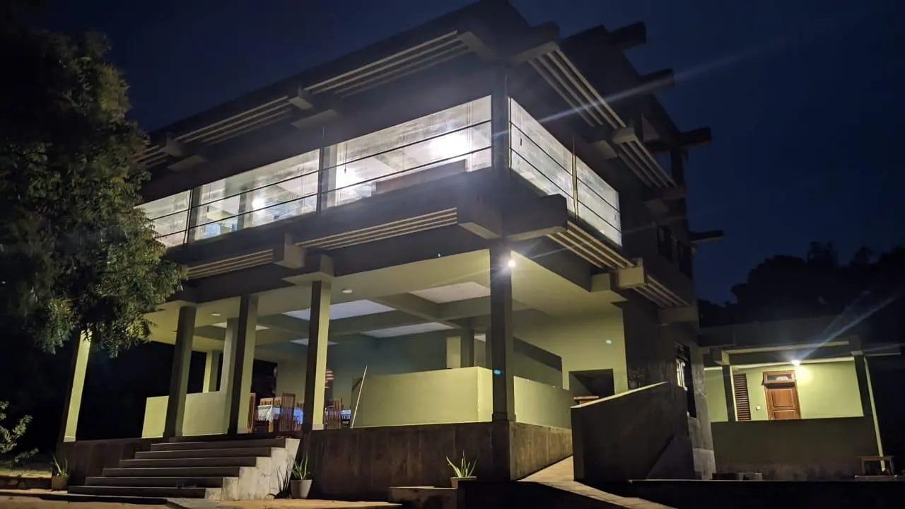Illuminated evening exterior and open common area at Yala Parana Thotupola Resort